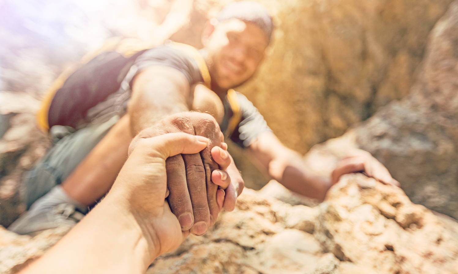 Adventurers Helping Each Other to Climb the Mountain